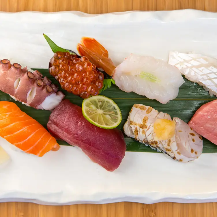 Sushi Den signature dishes New Style Salmon, Crispy Tuna, Omakase, Sashimi