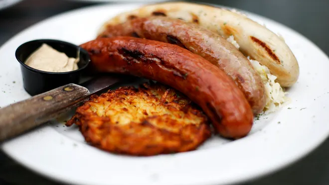 Mecklenburg Gardens signature dishes Sauerbraten, Wiener Schnitzel, Various Sausages (Bratwurst, Mettwurst), Giant Pretzels with Beer Cheese, Potato Pancakes.