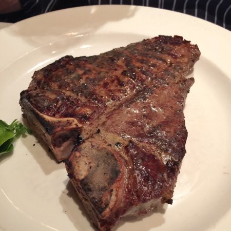 The Capital Grille signature dishes  Dry-Aged Porterhouse Steak, Seared Tenderloin with Butter Poached Lobster Tails, Pan-Fried Calamari with Hot Cherry Peppers, Lobster Mac 'N' Cheese, The Capital Grille Cheesecake.