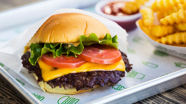 Shake Shack signature dishes ShackBurger®, SmokeShack®, 'Shroom Burger (vegetarian), Crinkle-Cut Fries, Shakes (various flavors).