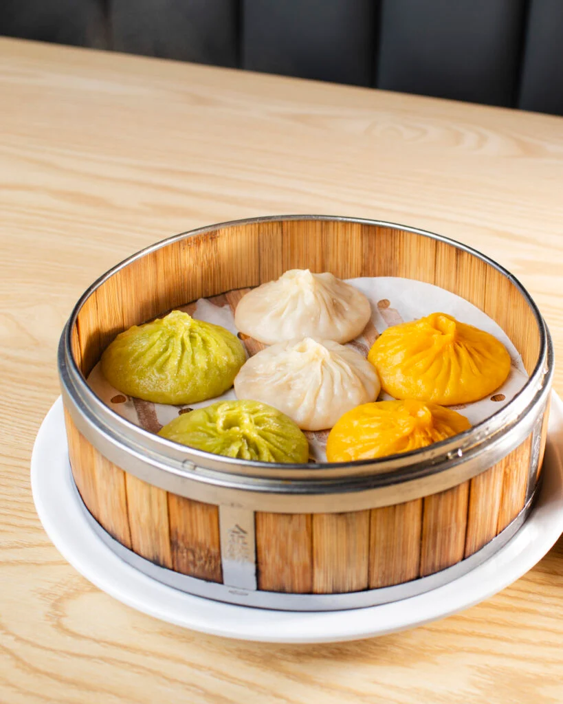 Dumpling Empire signature dishes 6 Tri-color Steamed Soup Buns, Chili Oil Sesame Noodle, 10 Strange Taste Wontons