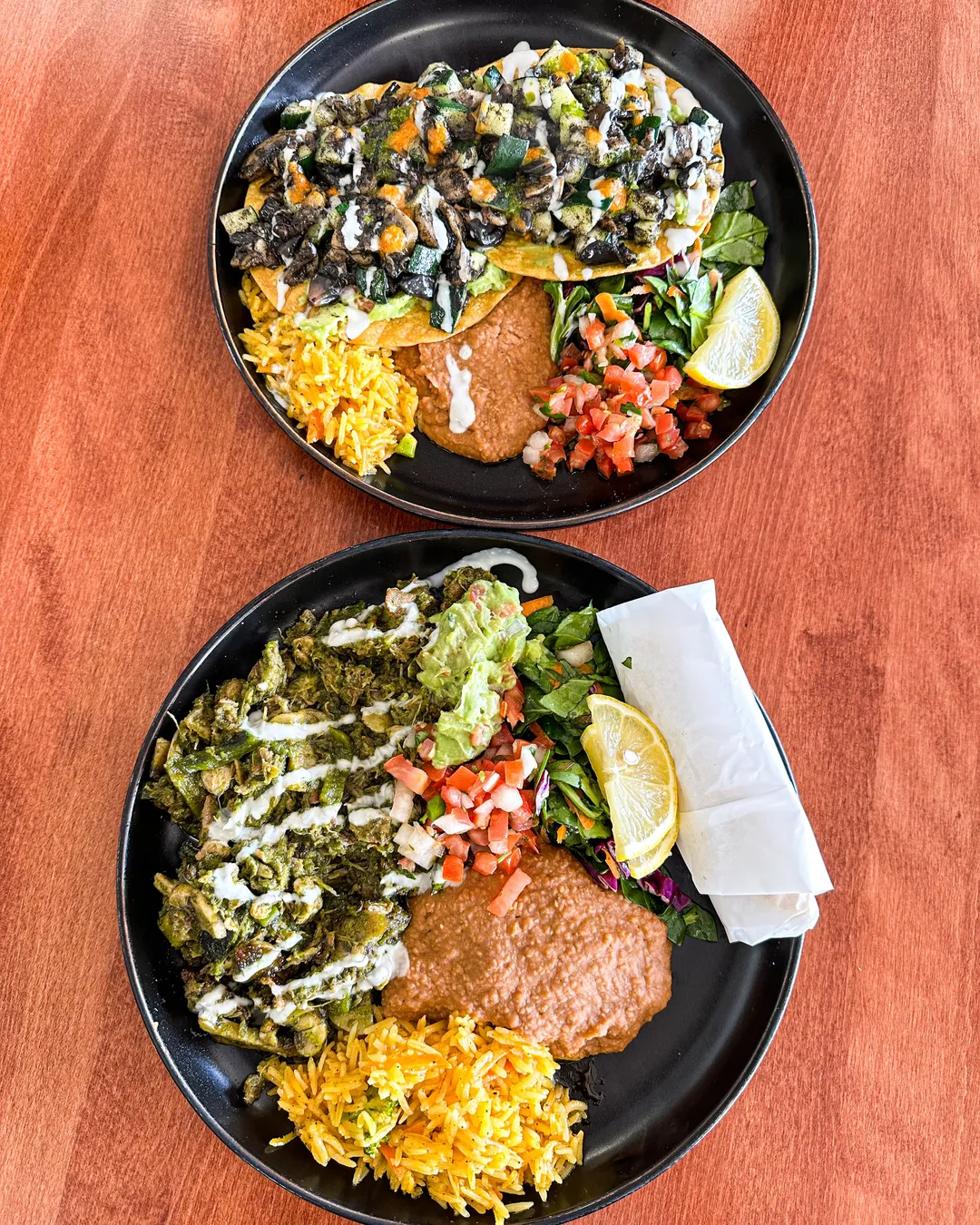 La Chaiteria signature dishes The menu changes daily and is written on a chalkboard; it typically features a selection of chicken, beef, pork, and vegetarian plates with complex sauces and fresh garnishes.