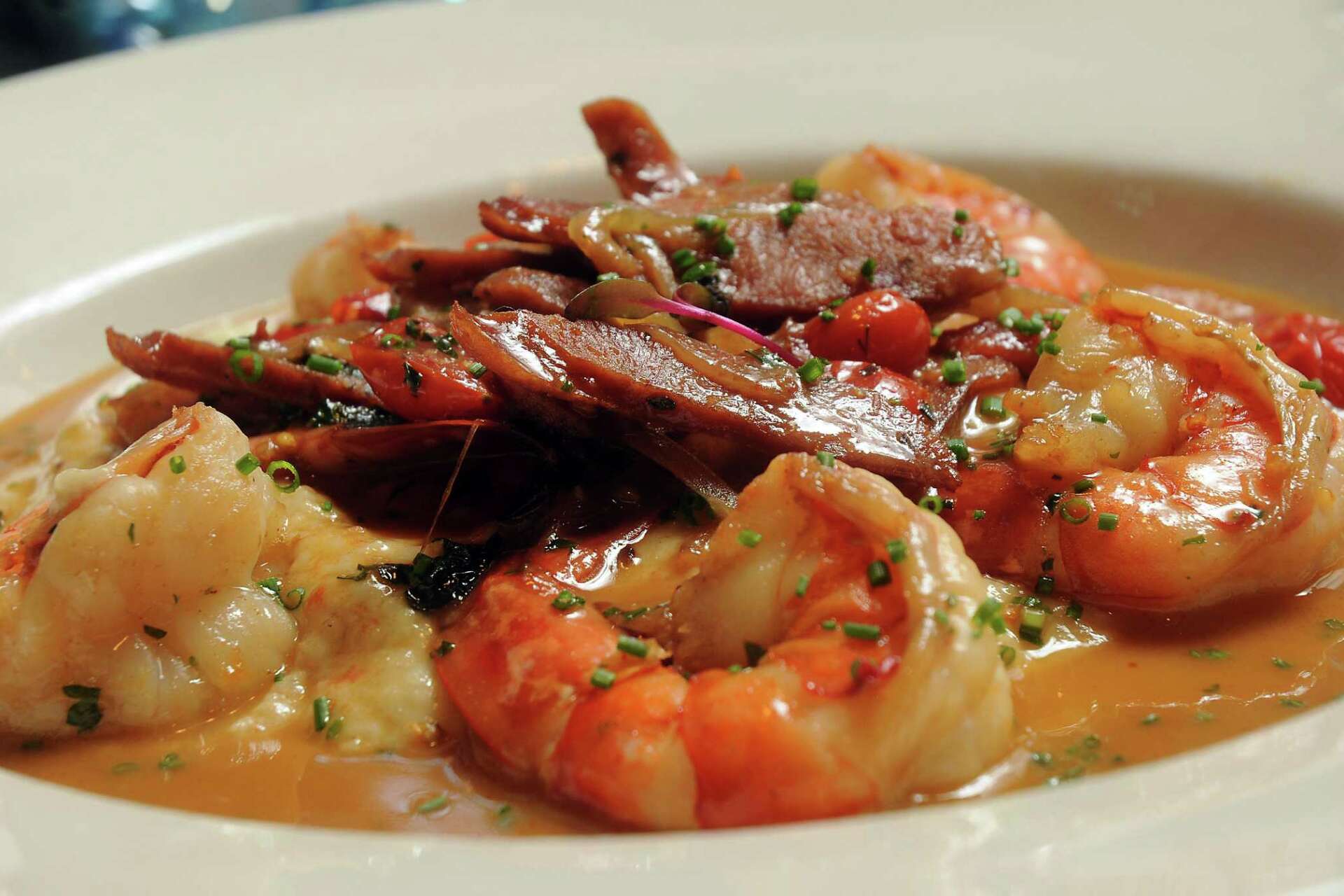 Lucilla signature dishes Fried ChickenShrimp and GritsDuck BreastBread Pudding